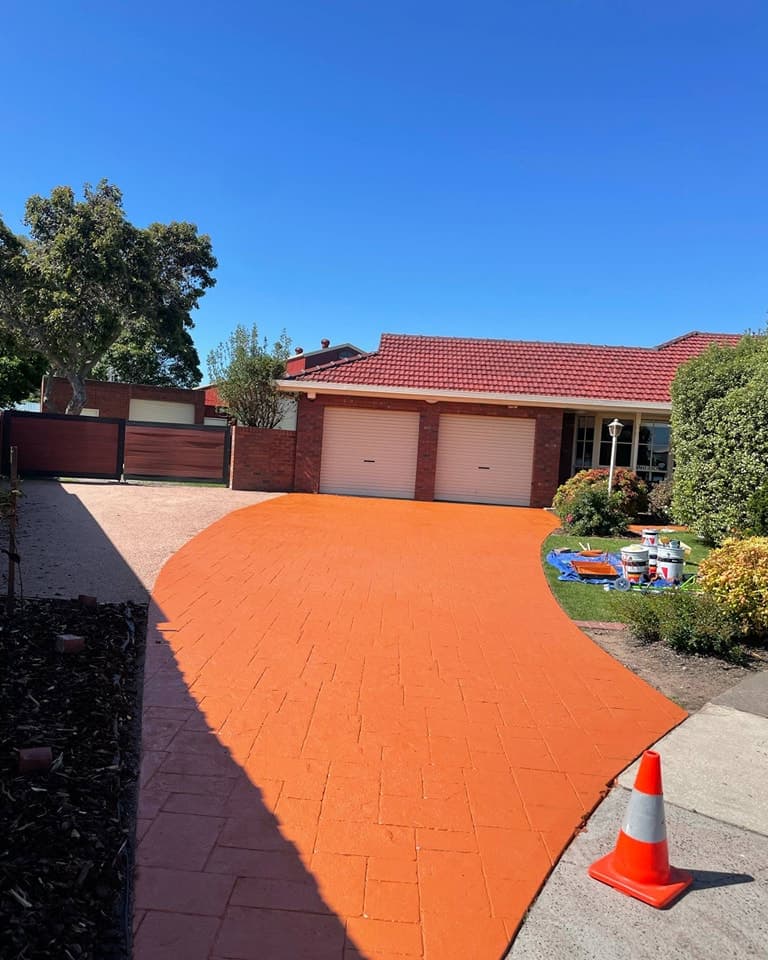 Terracotta colored decorative concrete driveway in Lakes Entrance