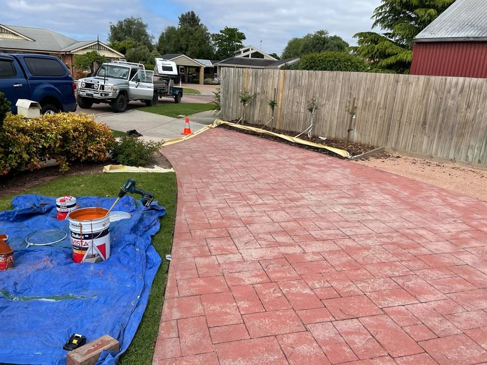 Old stained concrete driveway before terracotta makeover