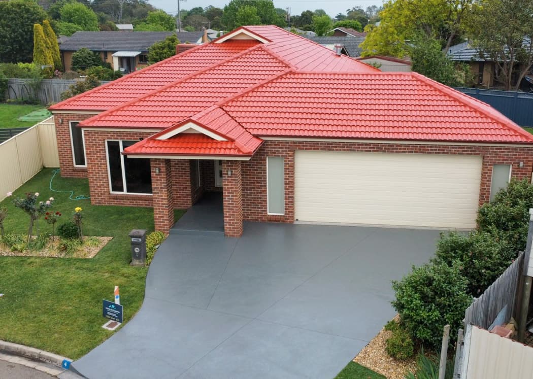 Monument finish concrete driveway after resurfacing in Bairnsdale